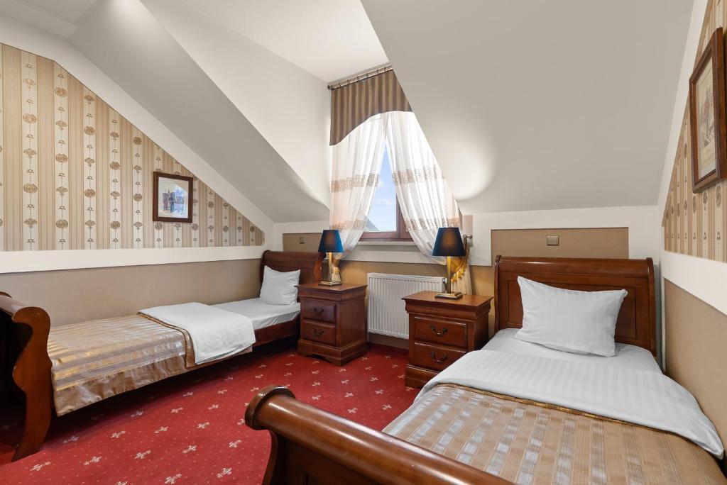 Postel nebo postele na pokoji v ubytování Hotel Diament Arsenal Palace Katowice - Chorzów