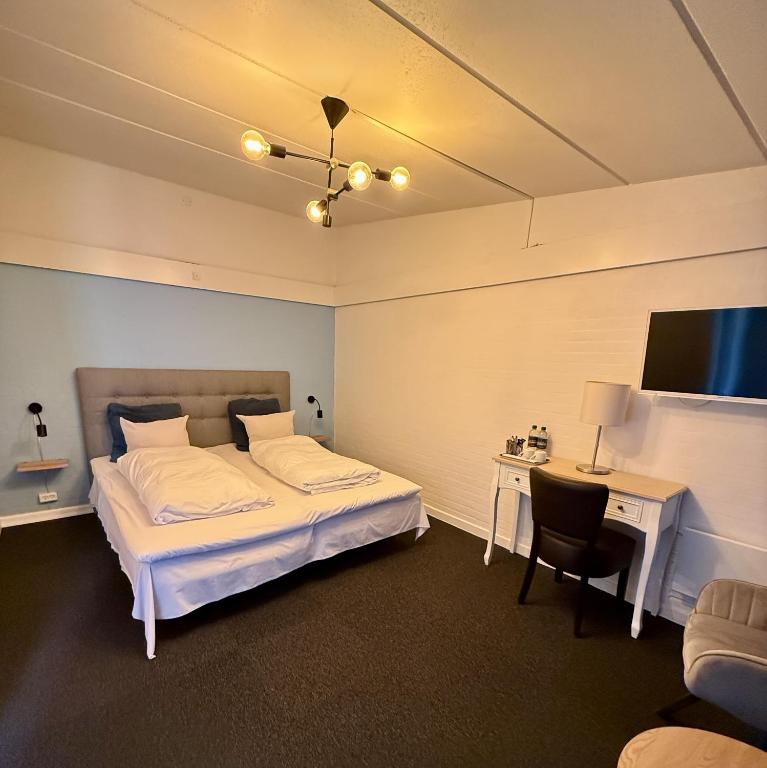 Postel nebo postele na pokoji v ubytování Hotel Birksø