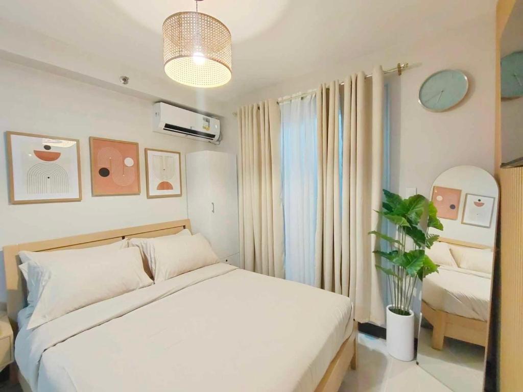 Ένα ή περισσότερα κρεβάτια σε δωμάτιο στο Aunt & Niece Condo Studio