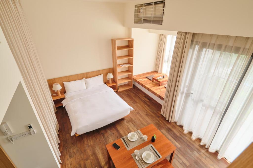 Postel nebo postele na pokoji v ubytování Wutong Hotel Apartment Bao'an Center