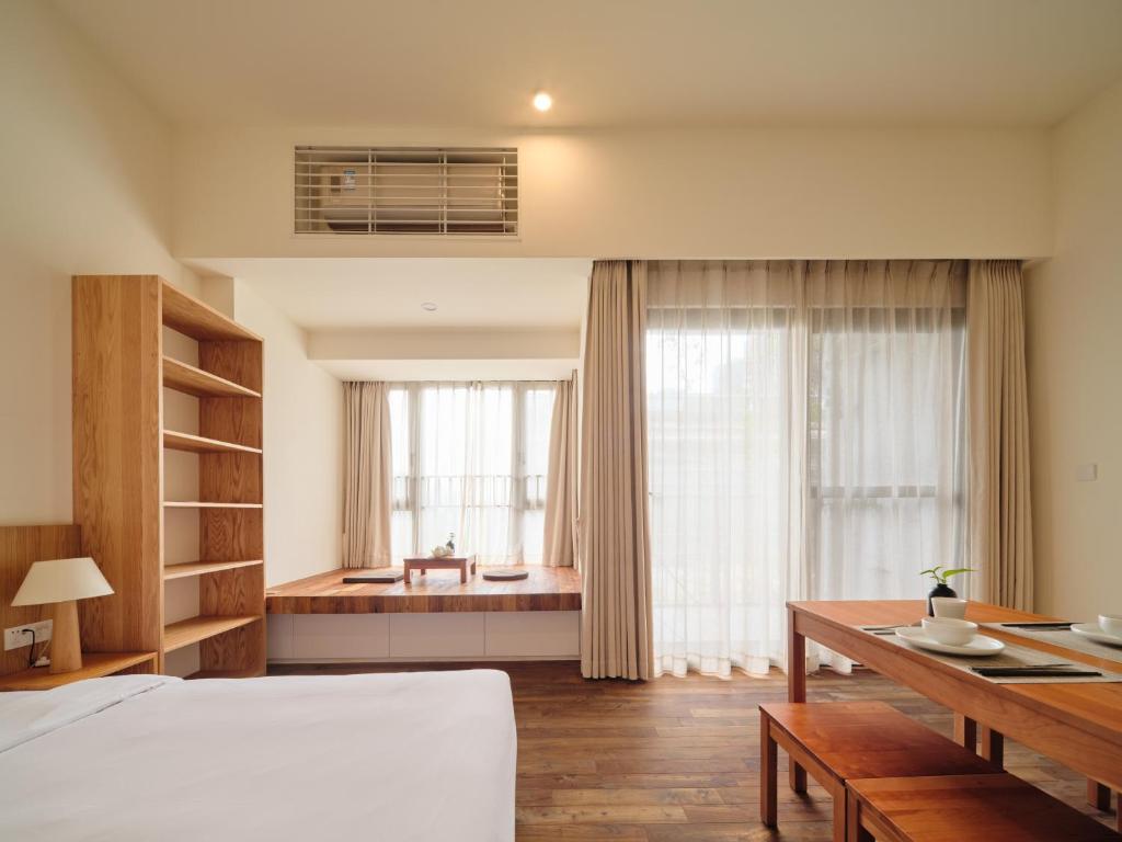 Postel nebo postele na pokoji v ubytování Wutong Hotel Apartment Bao'an Center