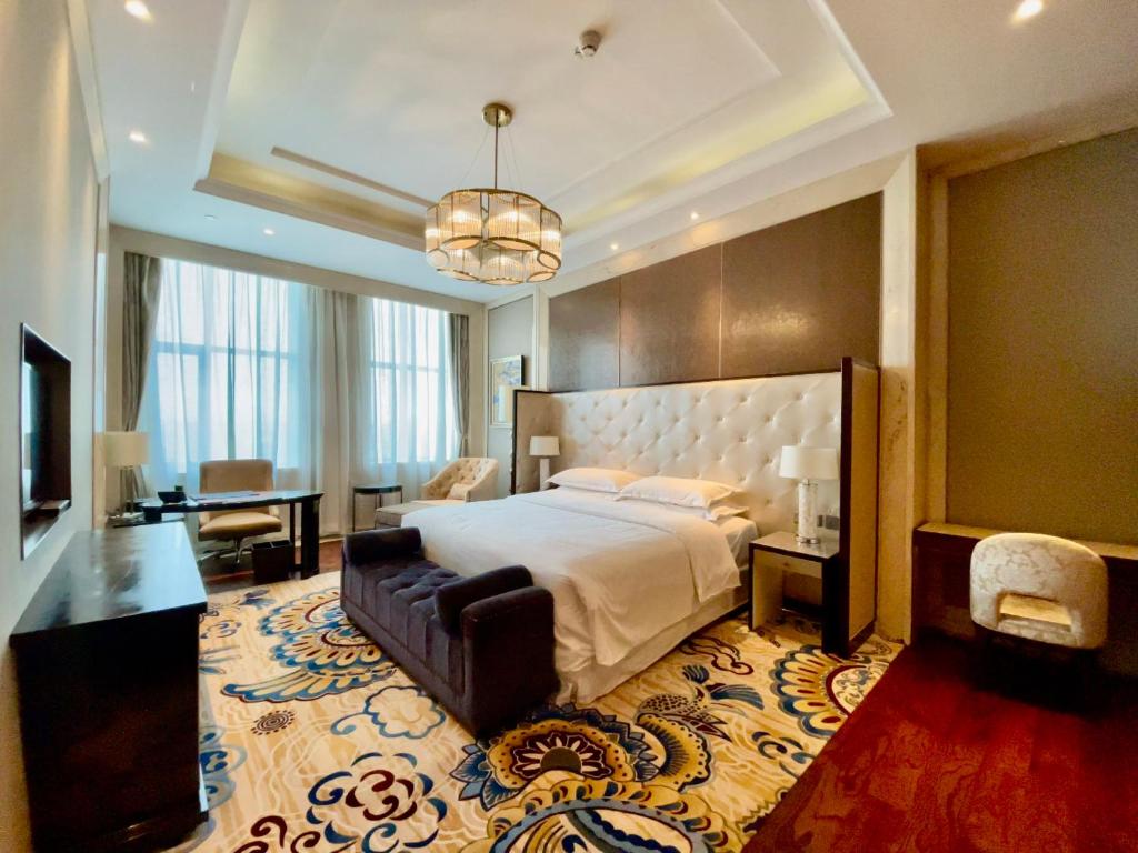 Postel nebo postele na pokoji v ubytování Sheraton Harbin Xiangfang Hotel
