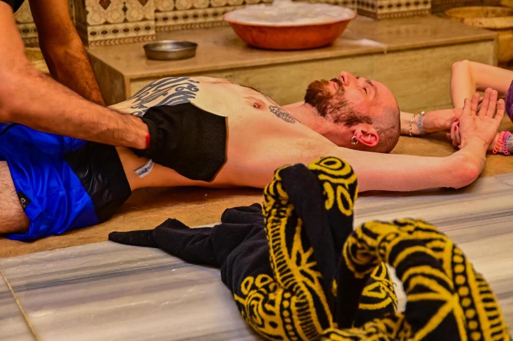 a man laying on the floor in a gym at Eagles Spa in Hurghada
