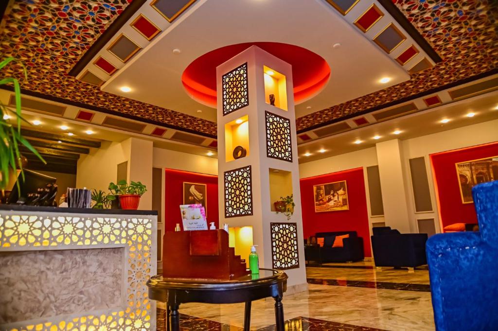 a lobby of a hotel with a fireplace at Eagles Spa in Hurghada