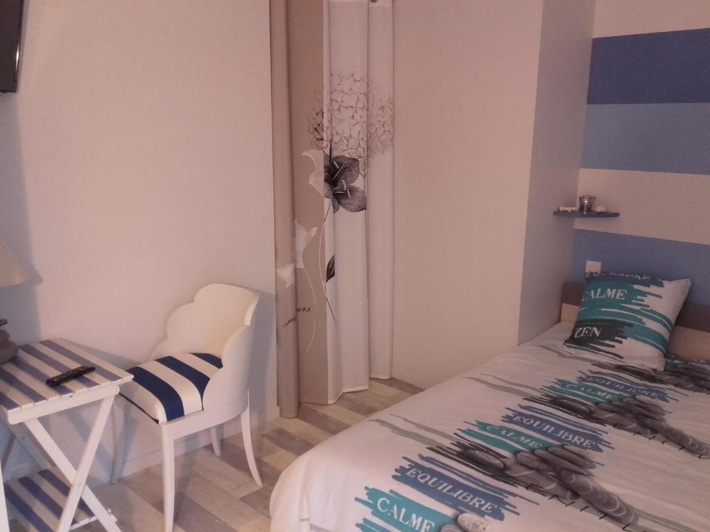Postel nebo postele na pokoji v ubytování Jeanne et Compagnie