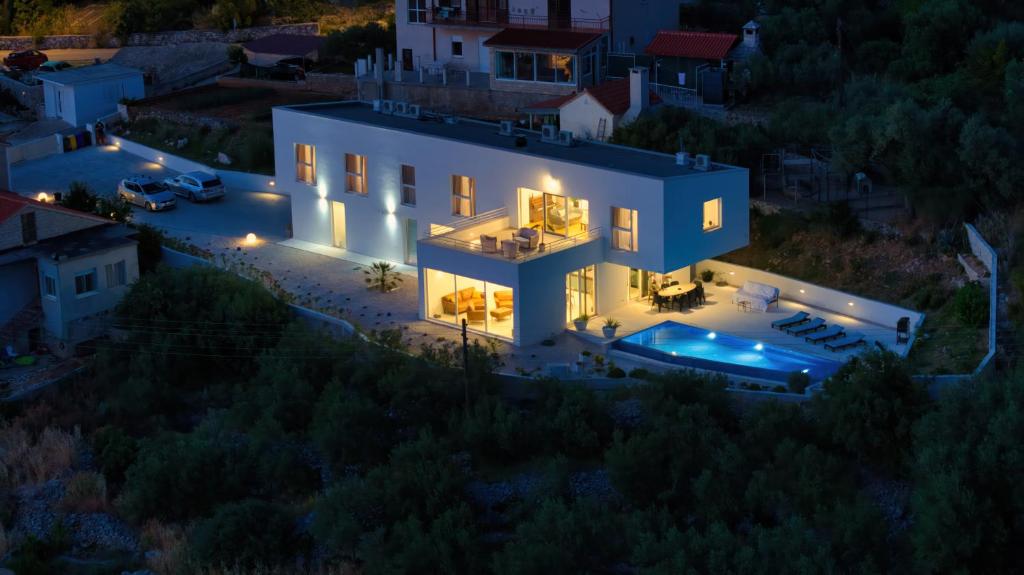 an aerial view of a house at night at Villa Campagna in Trogir
