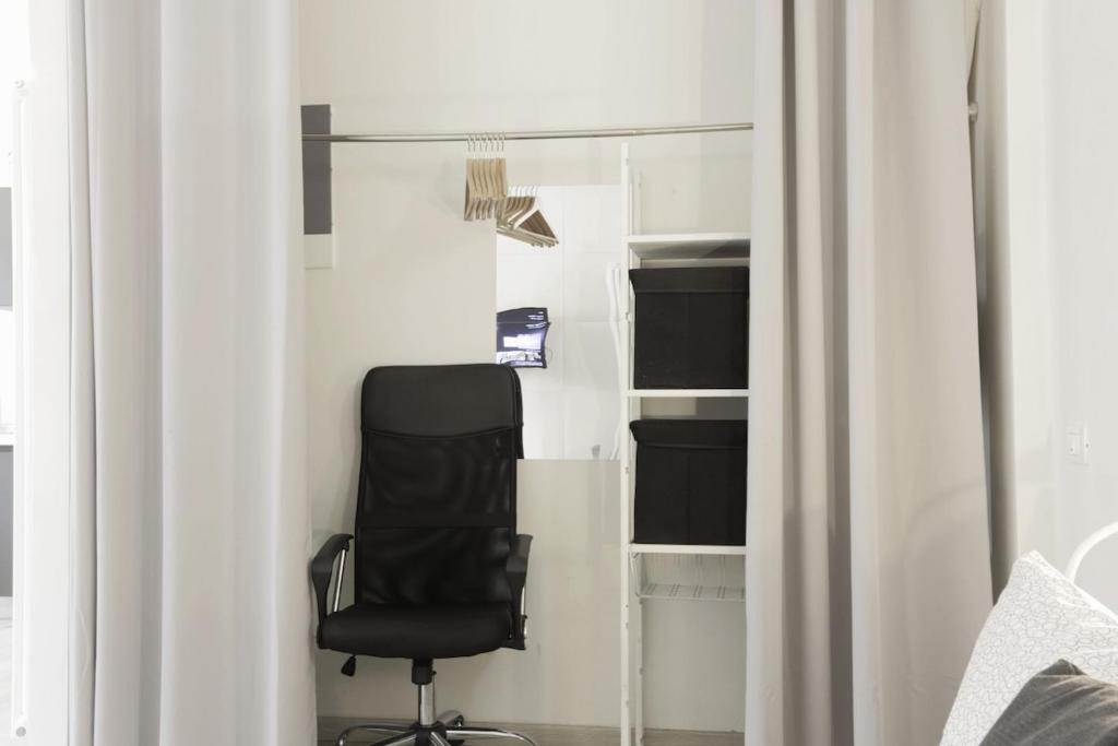 Televízia a/alebo spoločenská miestnosť v ubytovaní ALIMENTA open space city center