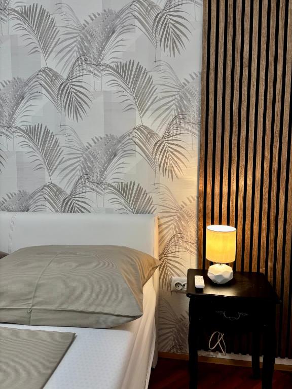 Posteľ alebo postele v izbe v ubytovaní Apartments ONE PALM