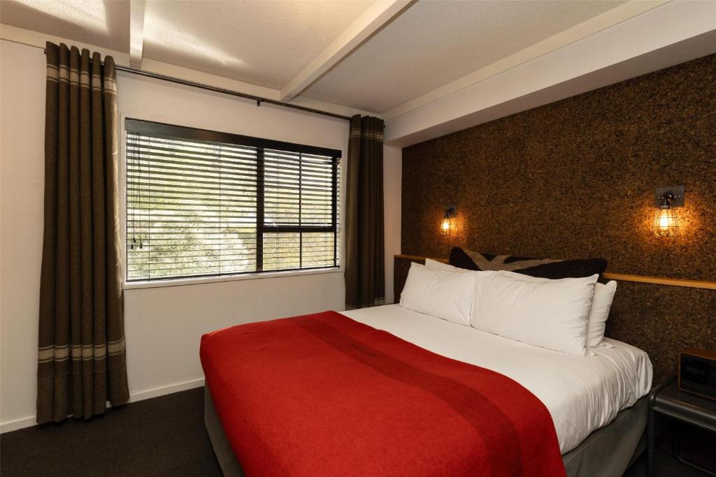 Postel nebo postele na pokoji v ubytování Sherwood Queenstown