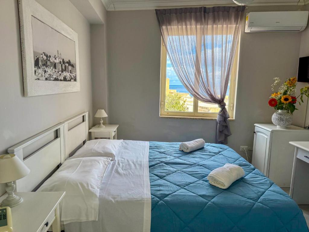 Postel nebo postele na pokoji v ubytování Hotel Odissea