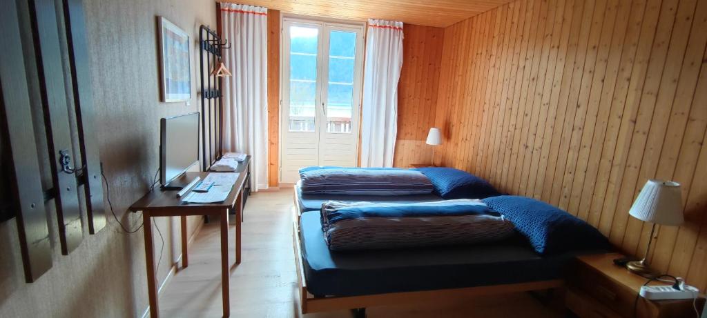 Postel nebo postele na pokoji v ubytování Fischers Lodge