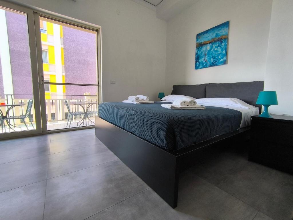 Postel nebo postele na pokoji v ubytování Miti Dello Stretto B&B