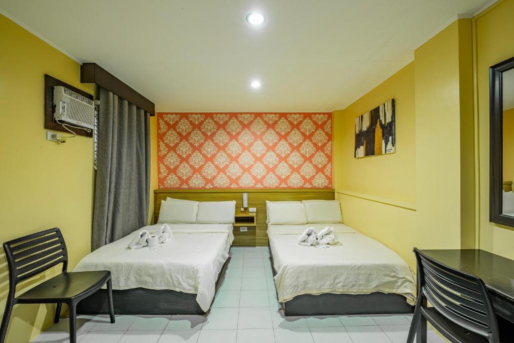 Postel nebo postele na pokoji v ubytování Hotel Juliano