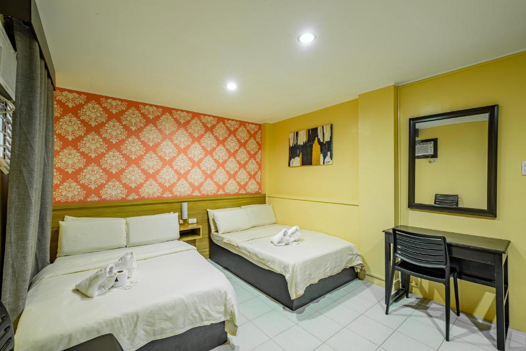 Postel nebo postele na pokoji v ubytování Hotel Juliano