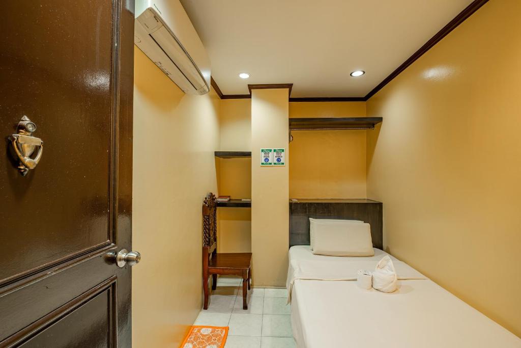 Postel nebo postele na pokoji v ubytování Hotel Juliano