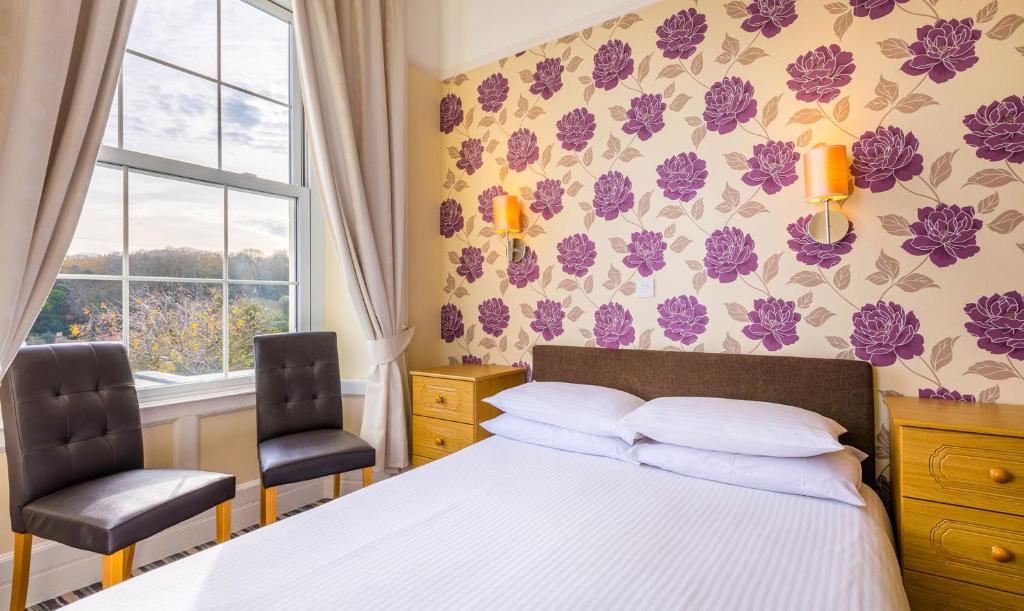 Postel nebo postele na pokoji v ubytování Pandora Hotel