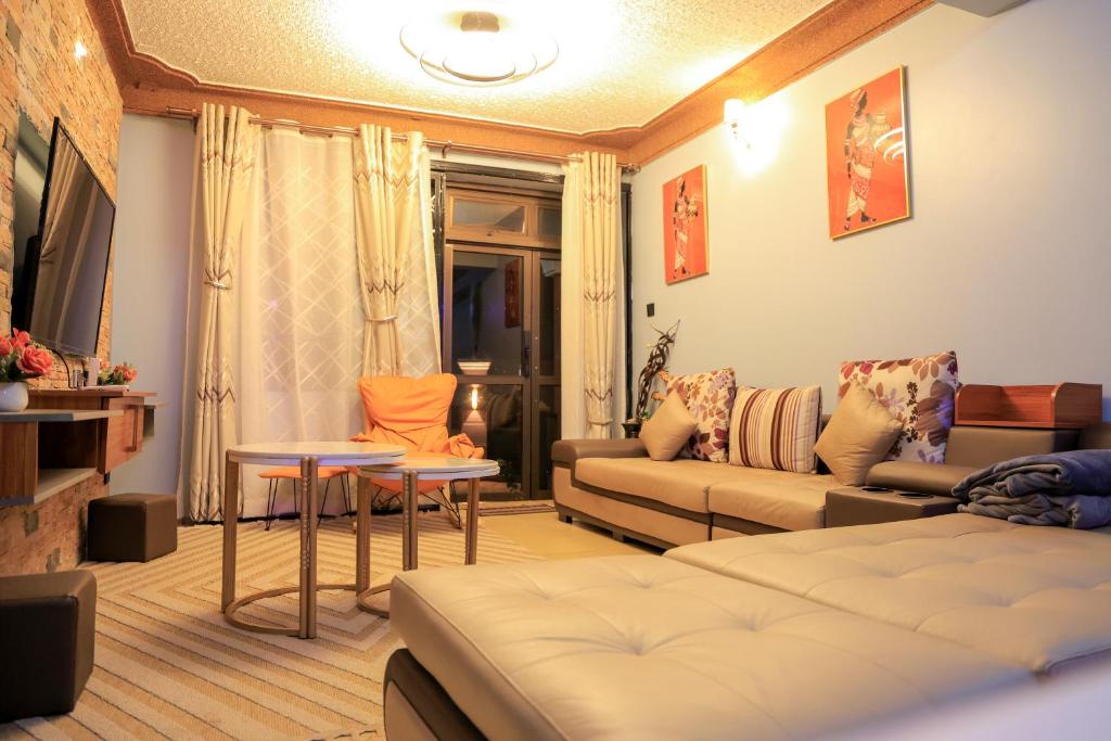 TV a/nebo společenská místnost v ubytování AG Homes