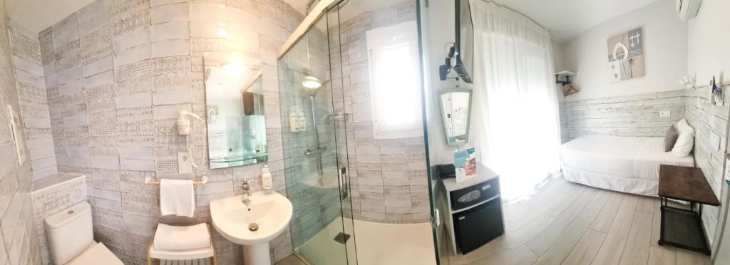 Koupelna v ubytování Hotel Clopy Rocamar