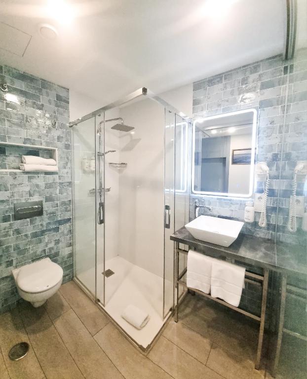 Koupelna v ubytování Hotel Clopy Rocamar