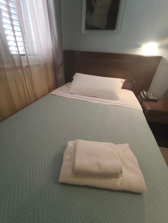 Postel nebo postele na pokoji v ubytování Albanuova Hotel
