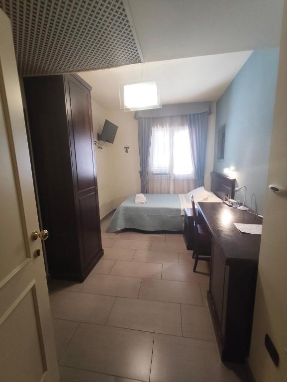 Postel nebo postele na pokoji v ubytování Albanuova Hotel