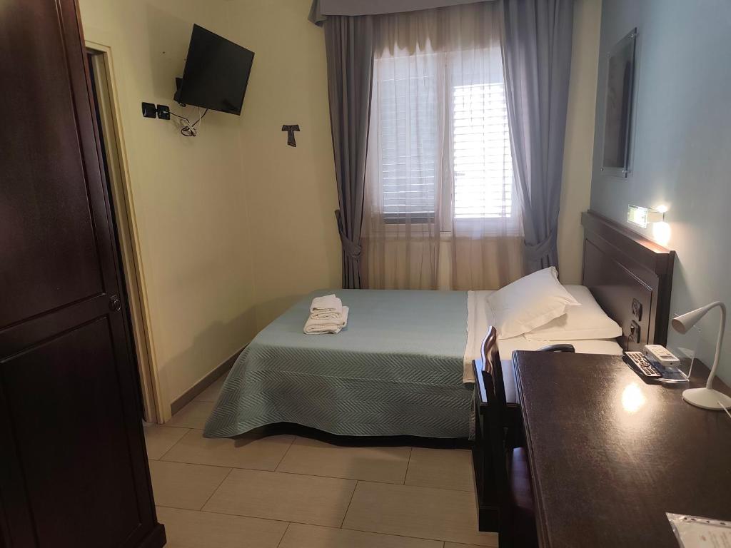 Postel nebo postele na pokoji v ubytování Albanuova Hotel