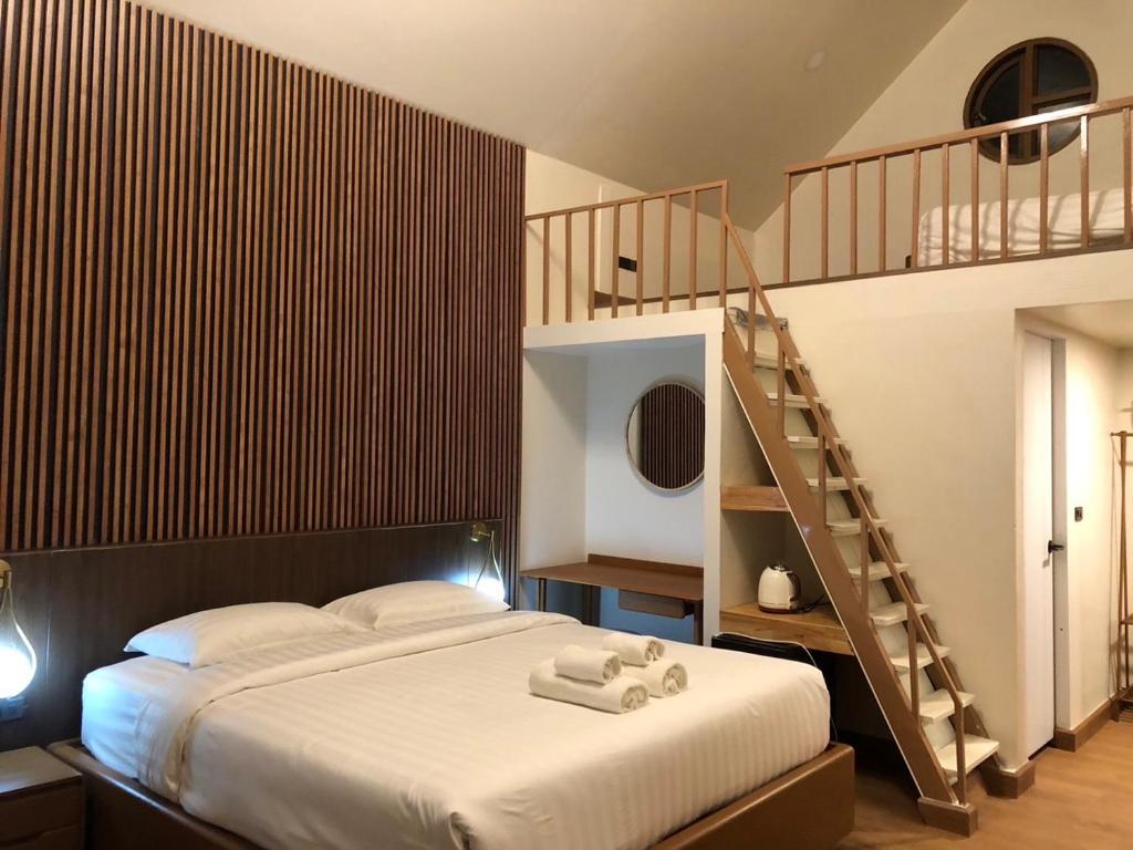 Postel nebo postele na pokoji v ubytování WC Coffee&ไร่หวานซึ้ง