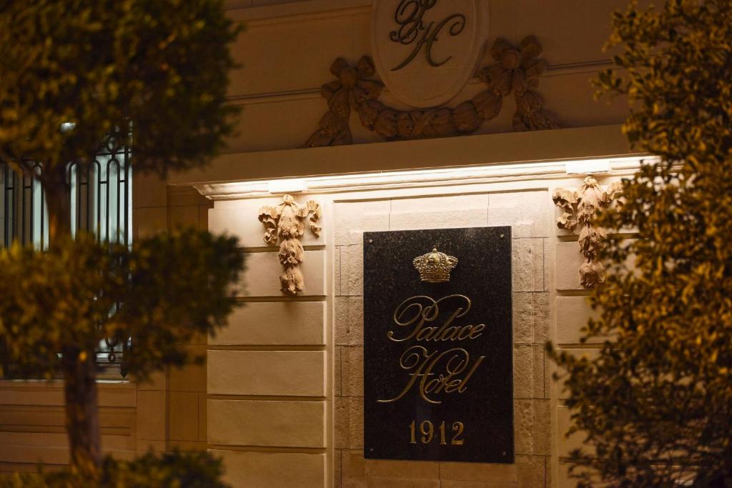 a sign on the side of a building at The Palace, a Luxury Collection Hotel, Madrid in Madrid