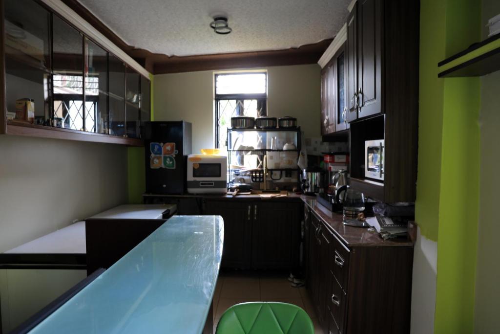 Kuchyň nebo kuchyňský kout v ubytování AG Home - Kampala