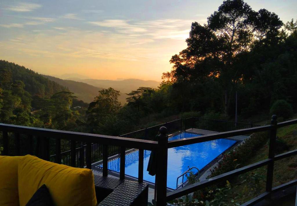 a view of a swimming pool from a balcony at Grand Hills kandy in Kandy