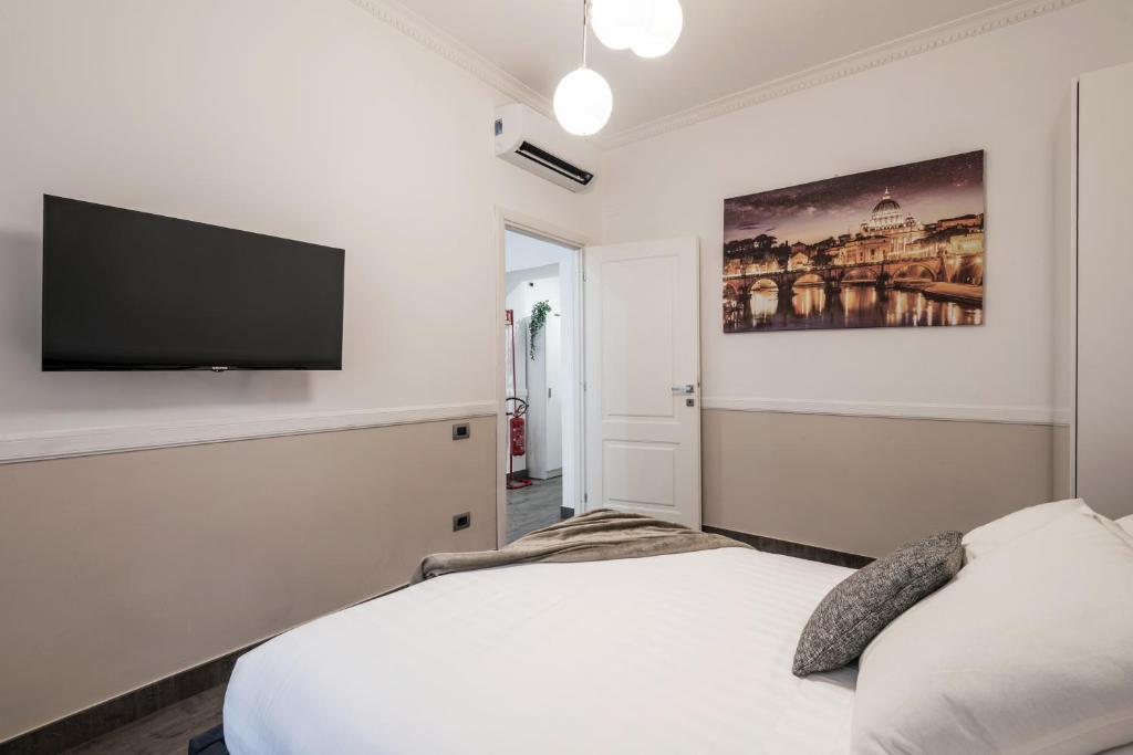 A bed or beds in a room at The Best Rent - Apartment in Testaccio district