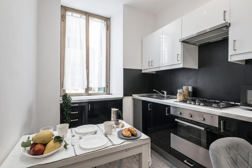 A kitchen or kitchenette at The Best Rent - Apartment in Testaccio district