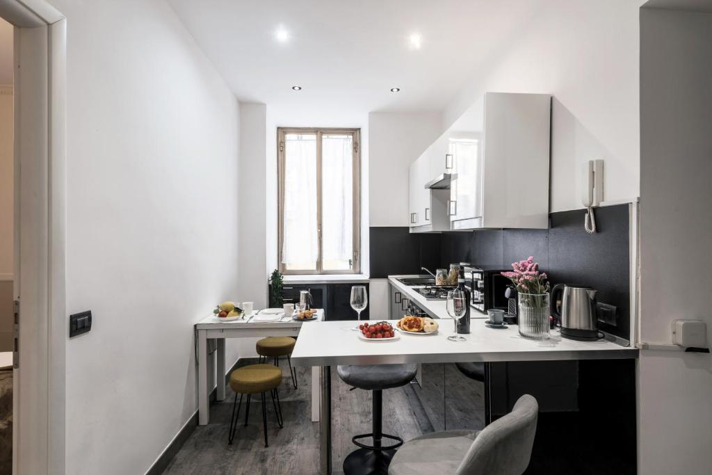 A kitchen or kitchenette at The Best Rent - Apartment in Testaccio district