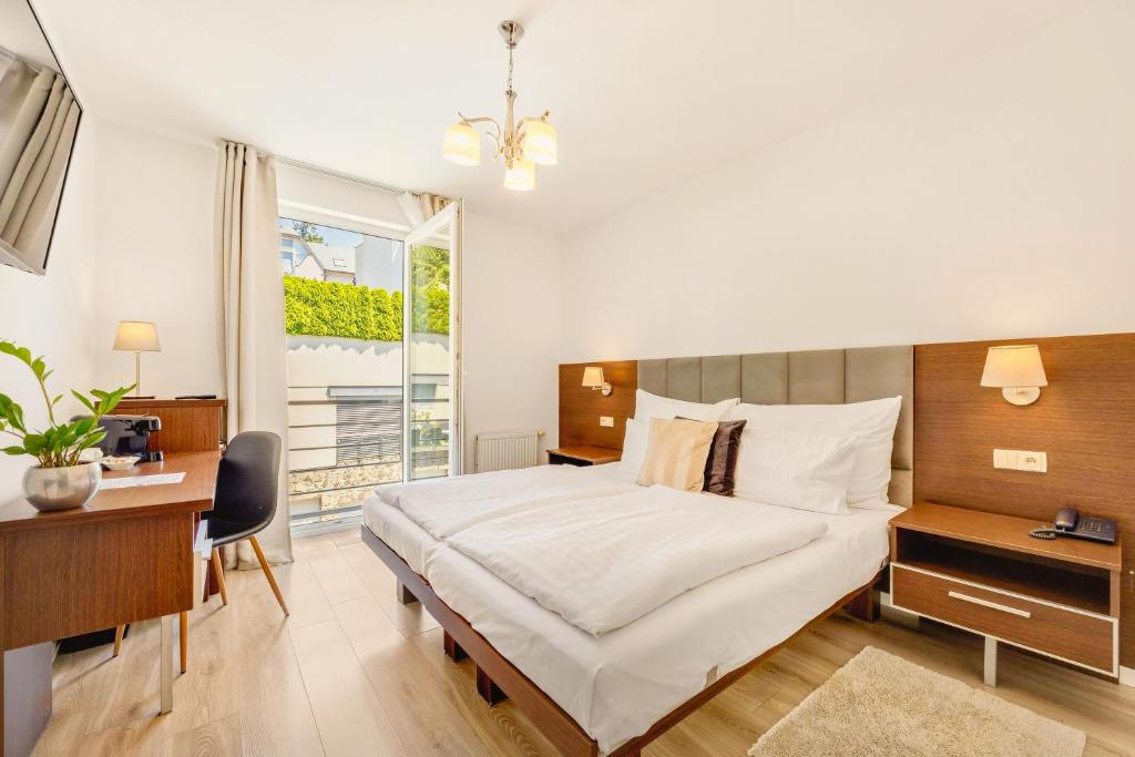 Postel nebo postele na pokoji v ubytování Hotel ANTARES
