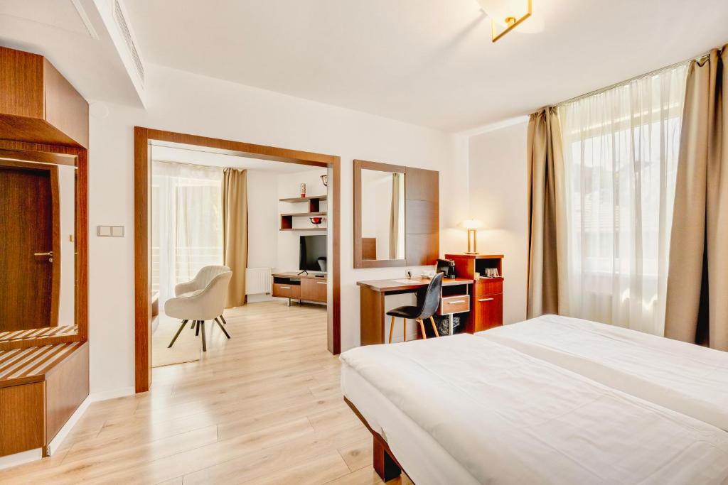 Postel nebo postele na pokoji v ubytování Hotel ANTARES