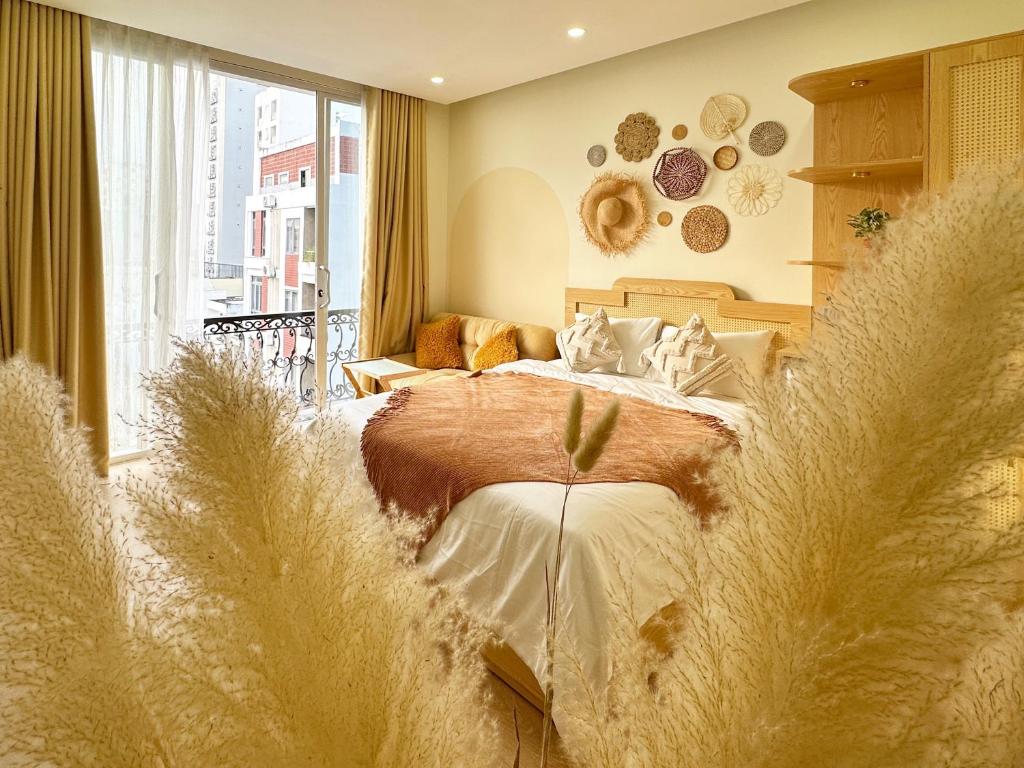 Ένα ή περισσότερα κρεβάτια σε δωμάτιο στο Nắng's Home & Studio