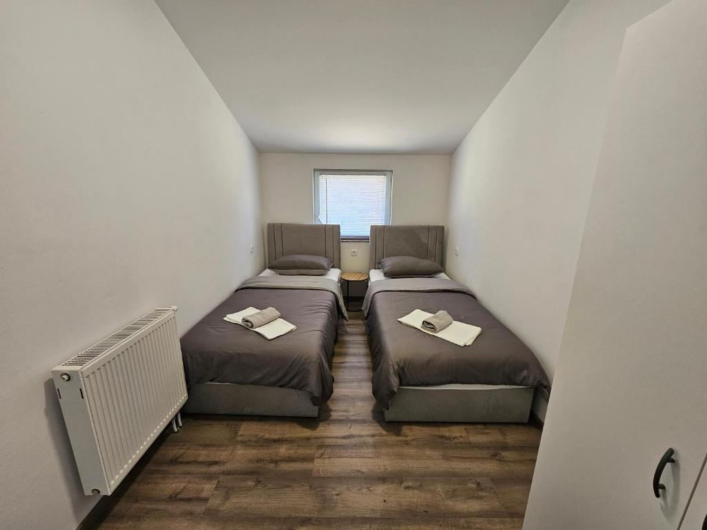 Postel nebo postele na pokoji v ubytování Apartman Ivan
