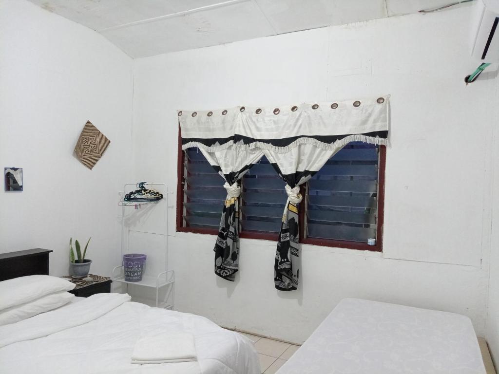 Postel nebo postele na pokoji v ubytování Mulu D Cave Homestay Room 2