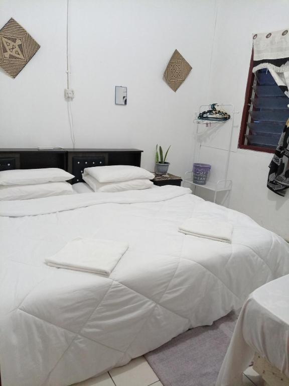Postel nebo postele na pokoji v ubytování Mulu D Cave Homestay Room 2