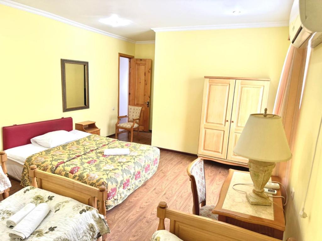 Postel nebo postele na pokoji v ubytování Hotel Lileo