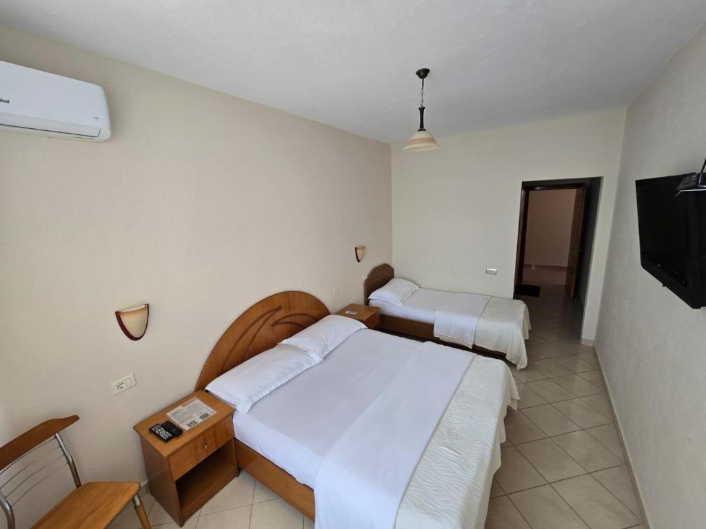 Postel nebo postele na pokoji v ubytování Hotel Belvedere