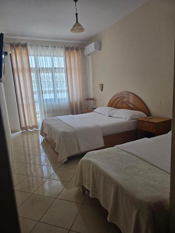 Postel nebo postele na pokoji v ubytování Hotel Belvedere