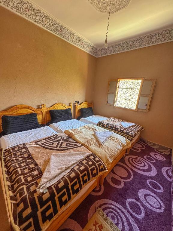Postel nebo postele na pokoji v ubytování Dar Akiode Toubkal