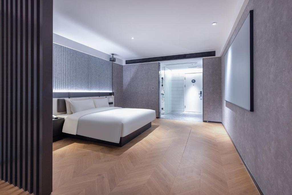Postel nebo postele na pokoji v ubytování Atour Light Hotel Fuzhou Sanfang Qixiang