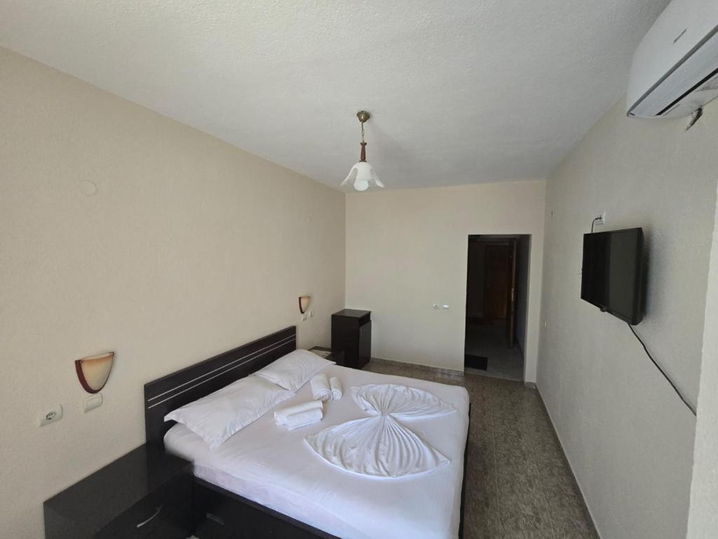 Postel nebo postele na pokoji v ubytování Hotel Belvedere