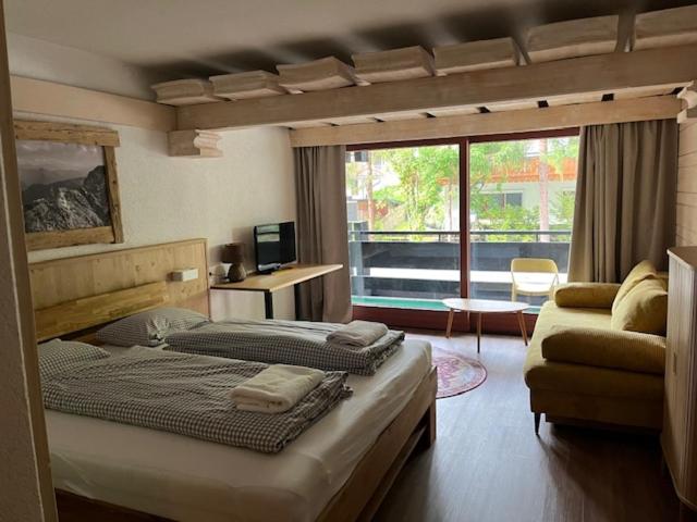 Postel nebo postele na pokoji v ubytování B&B in Seefeld
