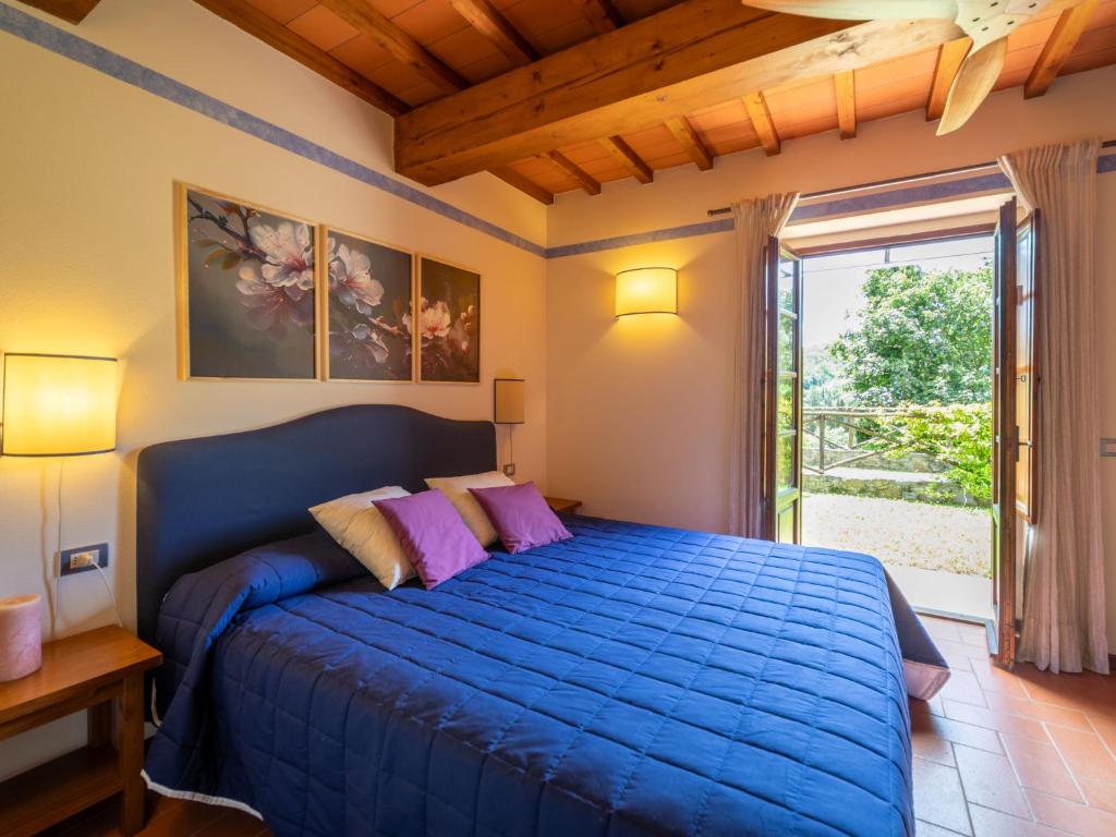A bed or beds in a room at Holiday Home La Torre by Interhome