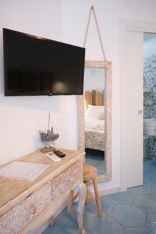 Postel nebo postele na pokoji v ubytování Pharus Miseni Suites and rooms