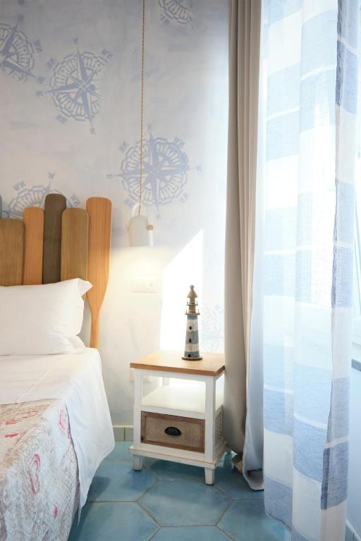 Postel nebo postele na pokoji v ubytování Pharus Miseni Suites and rooms