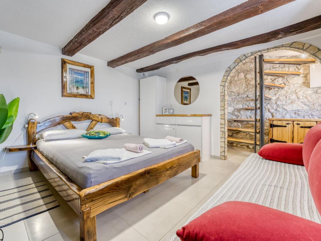 Posteľ alebo postele v izbe v ubytovaní Holiday Home Lovreno by Interhome